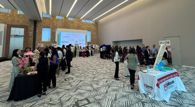 Image of students engaging with tables of SCJ Employee Resource Group info booths