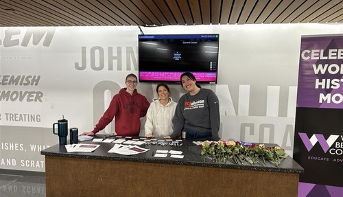 three women behind a table