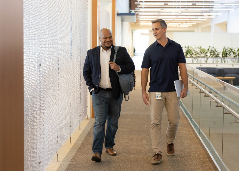 Employees walking inside Intel building