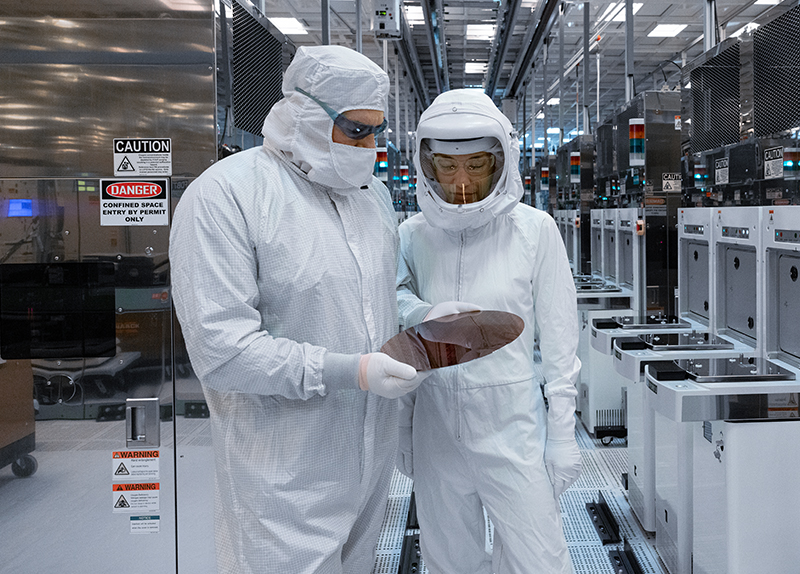 Two Scientists Looking at a Wafer