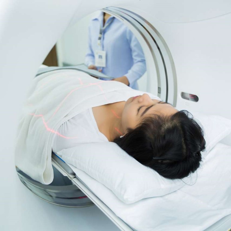 woman entering the a Ct scan