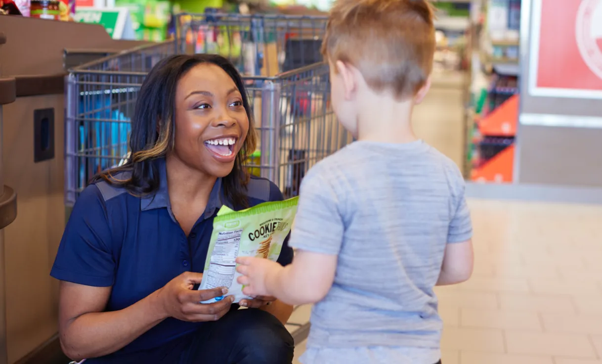 ALDI employee with a child