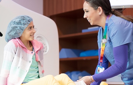 RN with patient smiling