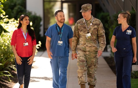 Military and RN staff walking