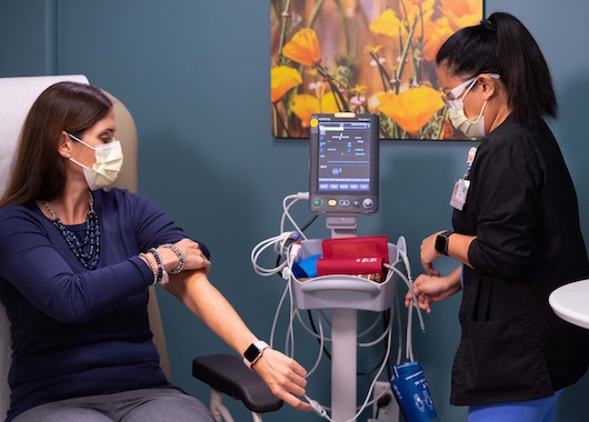 Phlebotomist with patient