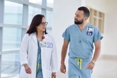 RN Manager walking with team member