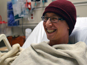 Patient smiling in hospital bed