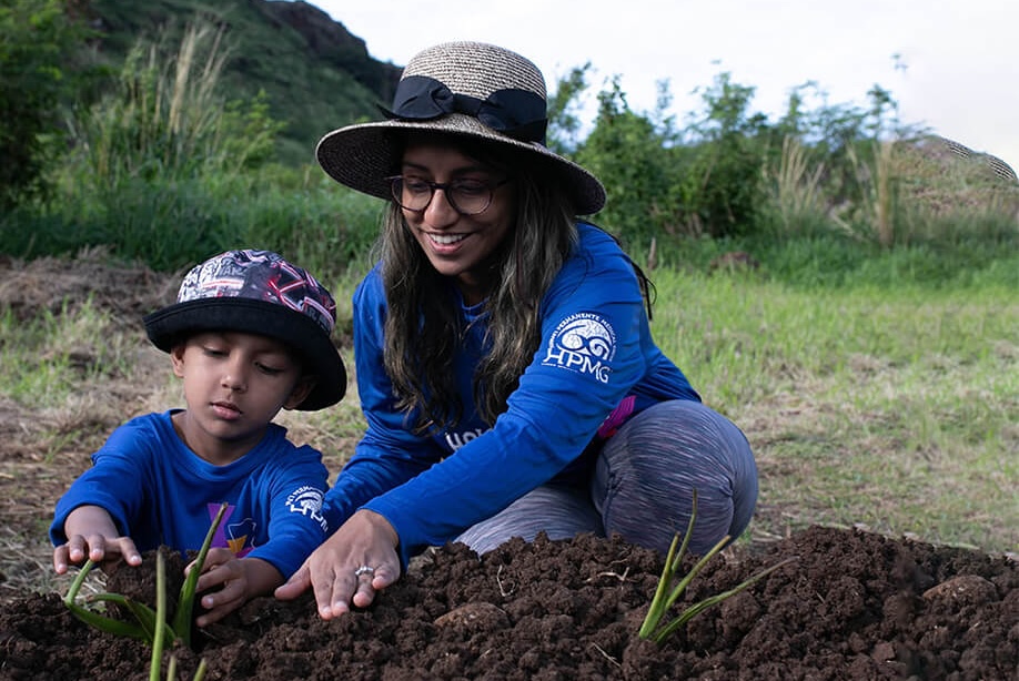 Mom and son planting