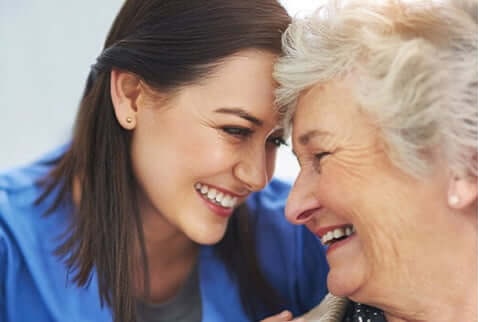 Nurse smiling with patient