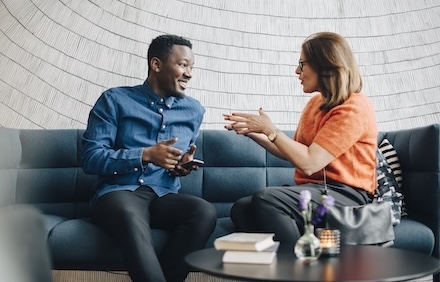 Colleagues hanging out on a couch