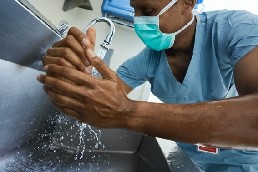 young man wearing ppe mask