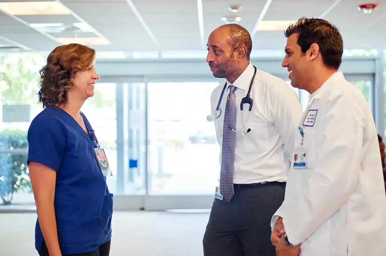 Nurse and doctors having conversation