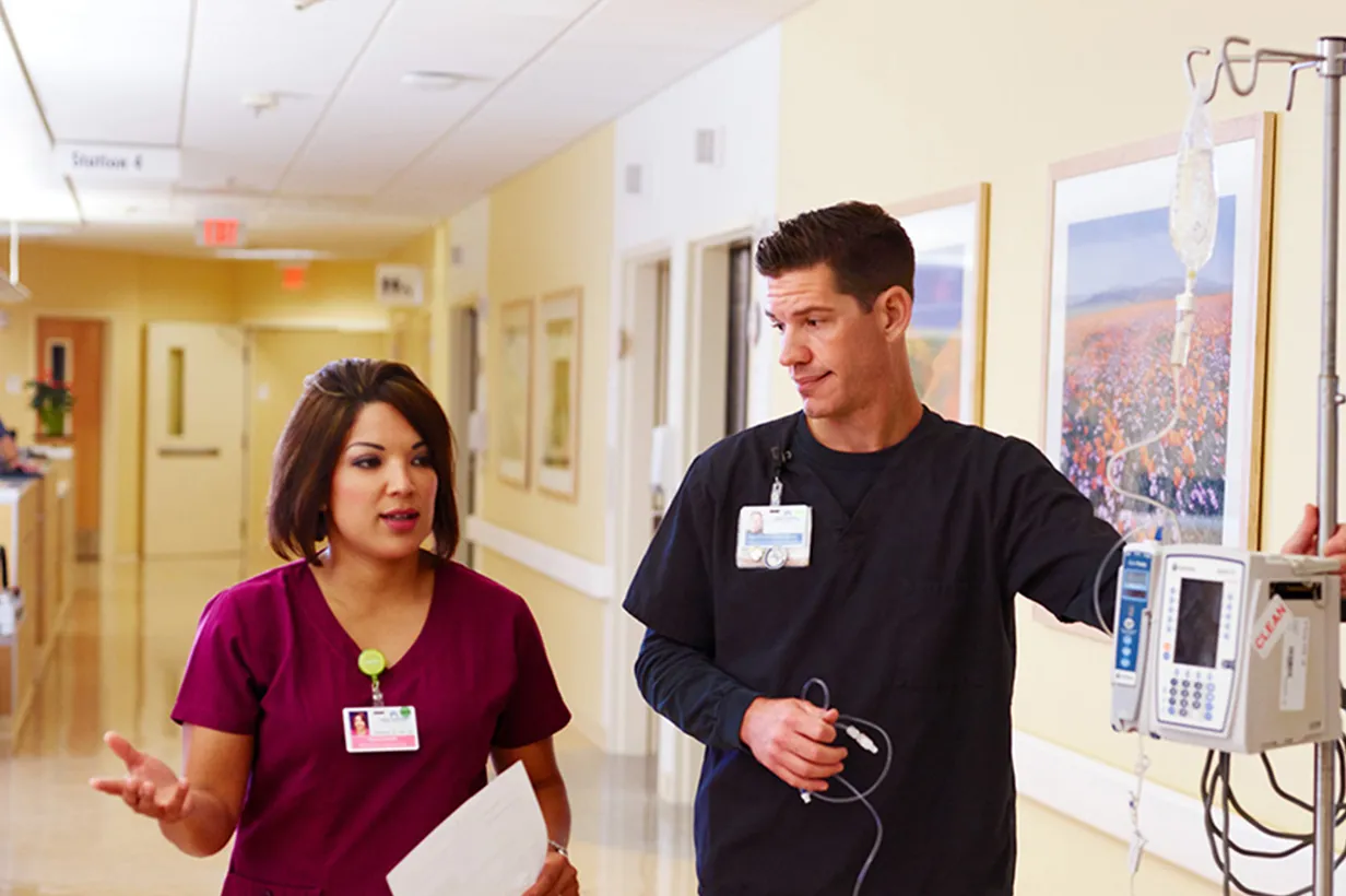 Nurse and doctor having conversation