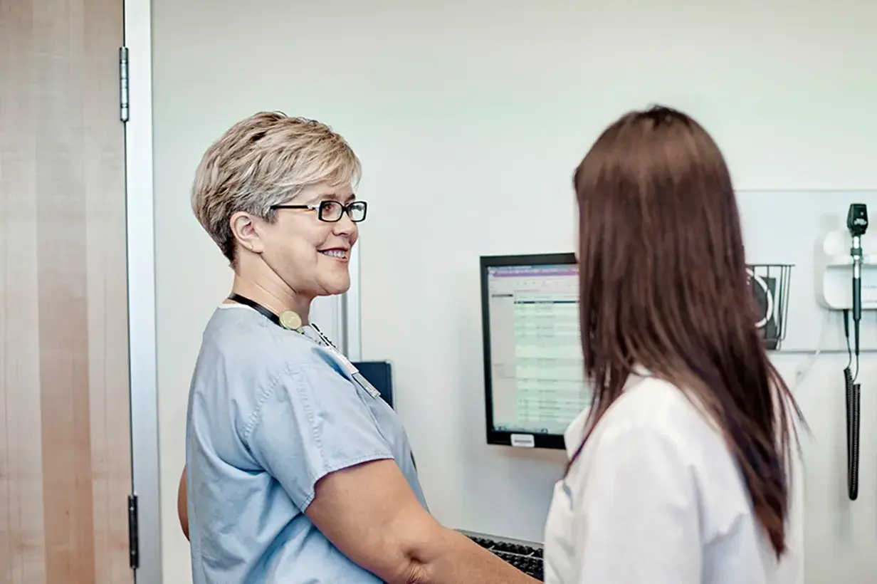 Nurse and doctor having conversation