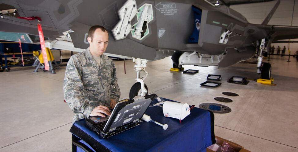 Military aircraft maintainer working on an F-35