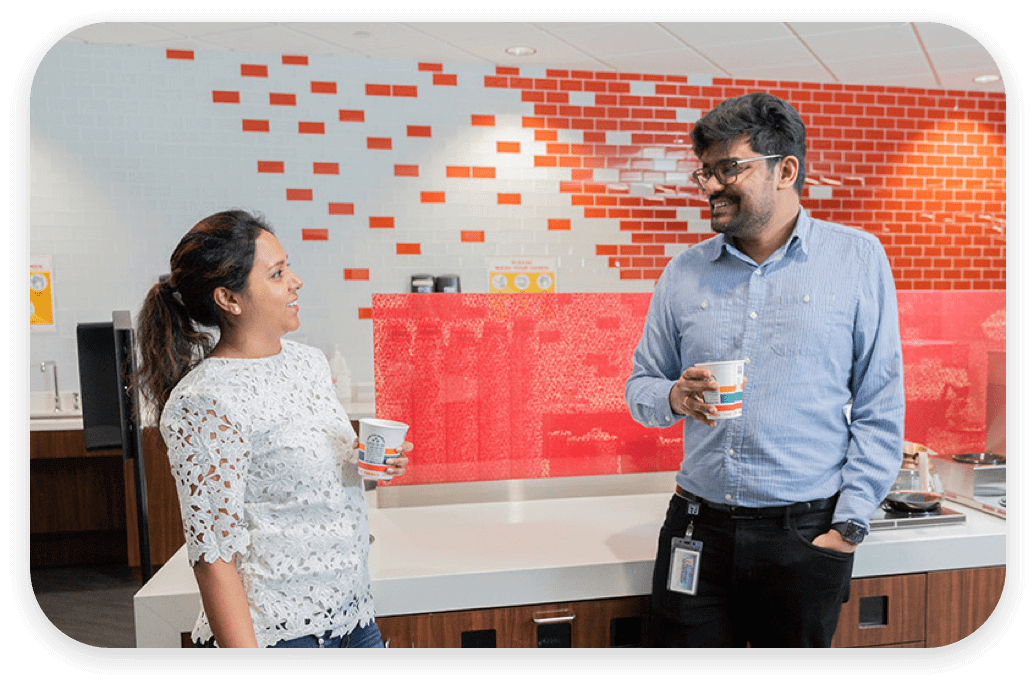 Male and female colleagues having drinks together