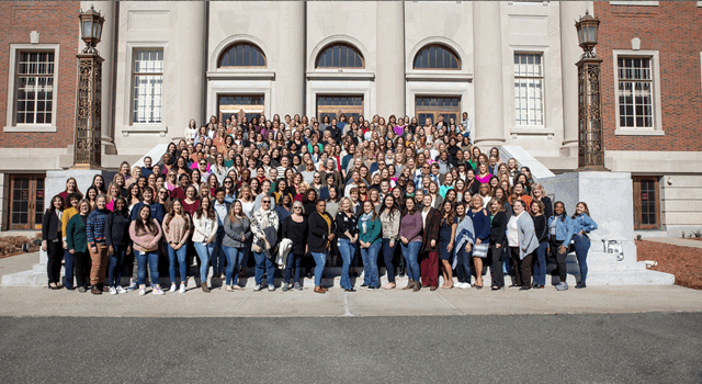 large group of women smiling for the camera