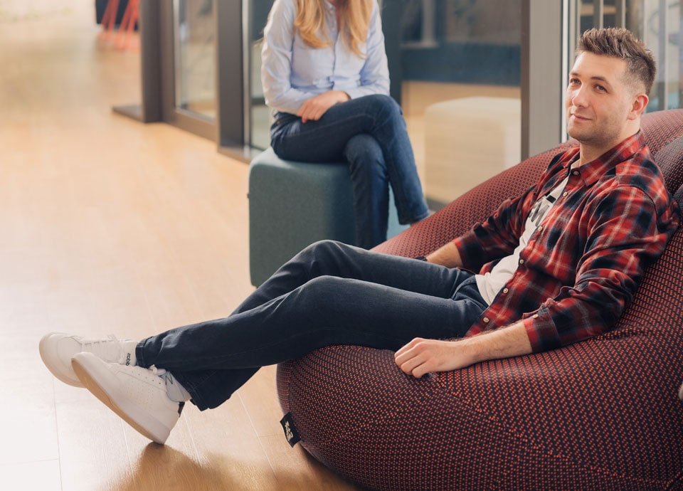 Men relaxing in the office common area.