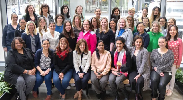 large group of women smiling for the camera