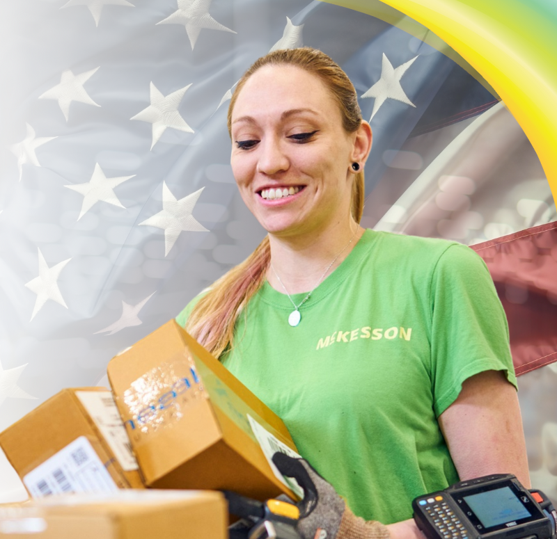 woman working in a McKesson distribution center smiling