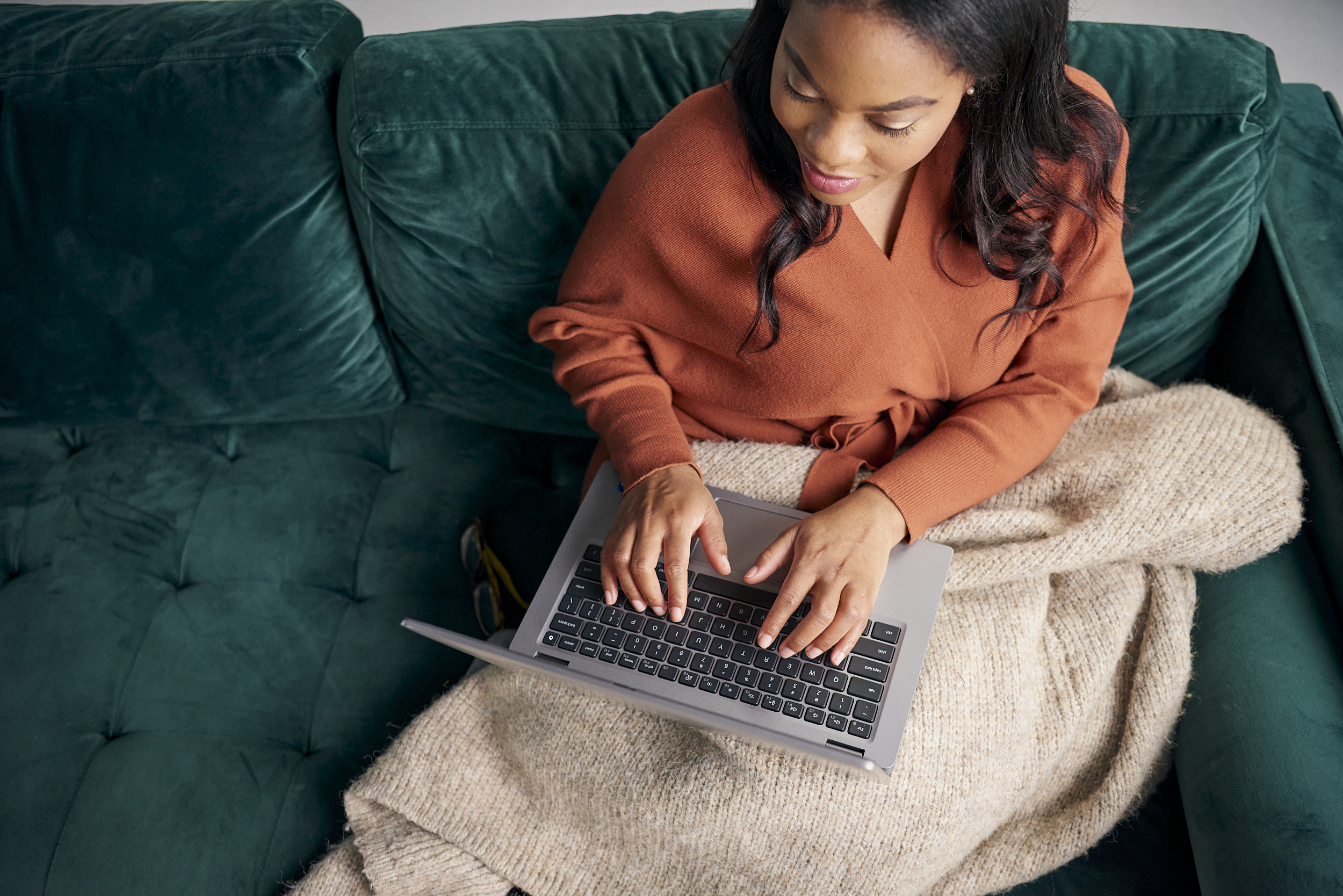 Person typing on a laptop computer