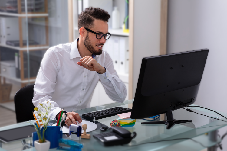 young professional man working at laptop