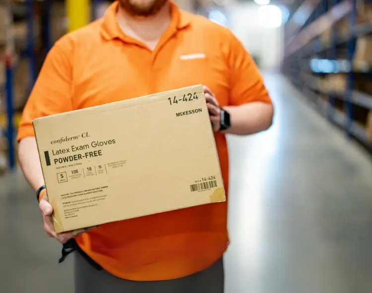 a man holding cardboard box