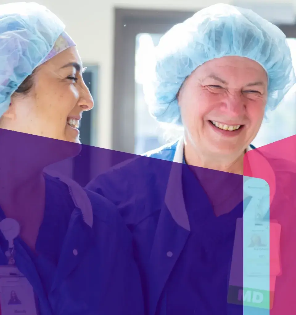 two employes smiling