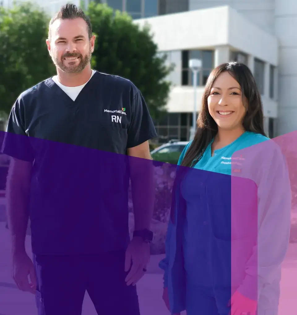 two employes smiling