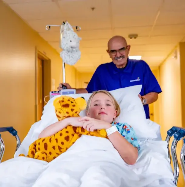 employee helping patient
