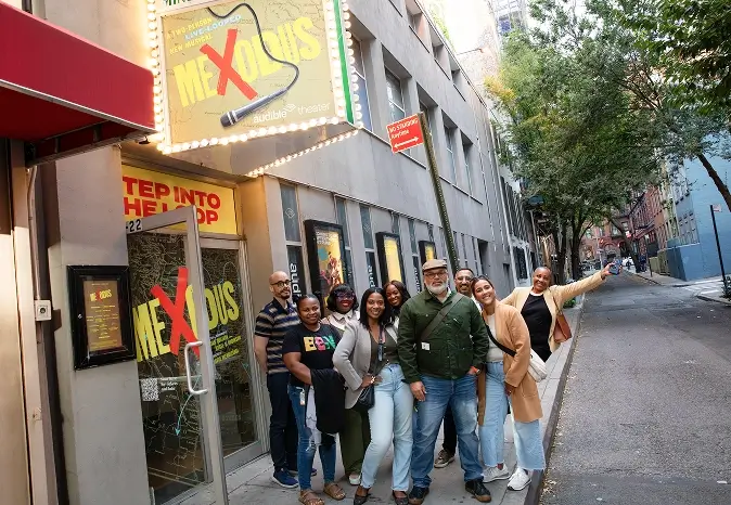 Group of people standing on the sidewalk