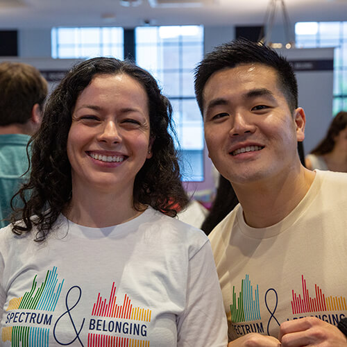 Two Audible team members smiling
