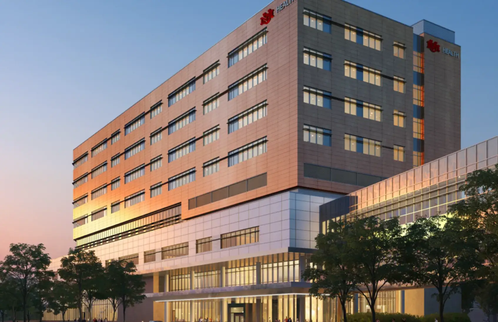 UNM Hospital critical care tower at sunset