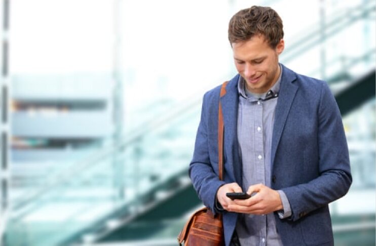 Man on phone scheduling a health screening