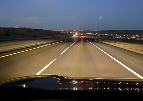 A view of the road from a driver's perspective inside the car.
