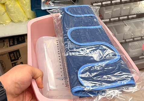 A photo of Darrell's hand holding a collection medical supplies