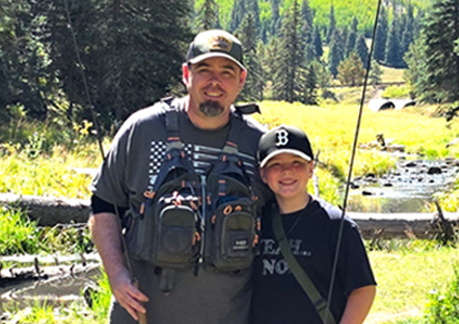 Sean and his son on a fishing trip.