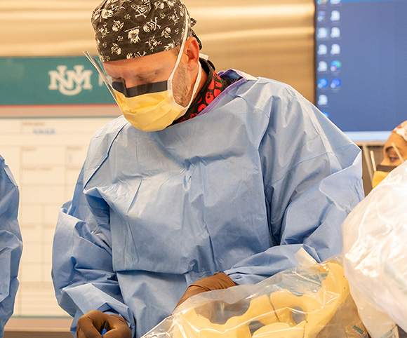 Dr. Matthew Wharton operating on a patient