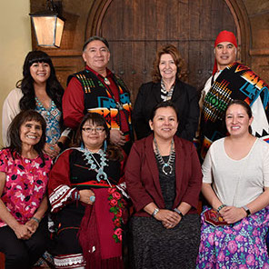 8 Navajo men and women in traditional dress