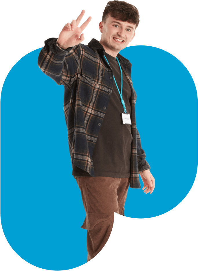 Plaid shirt man with blue polka dot tie showing peace sign.