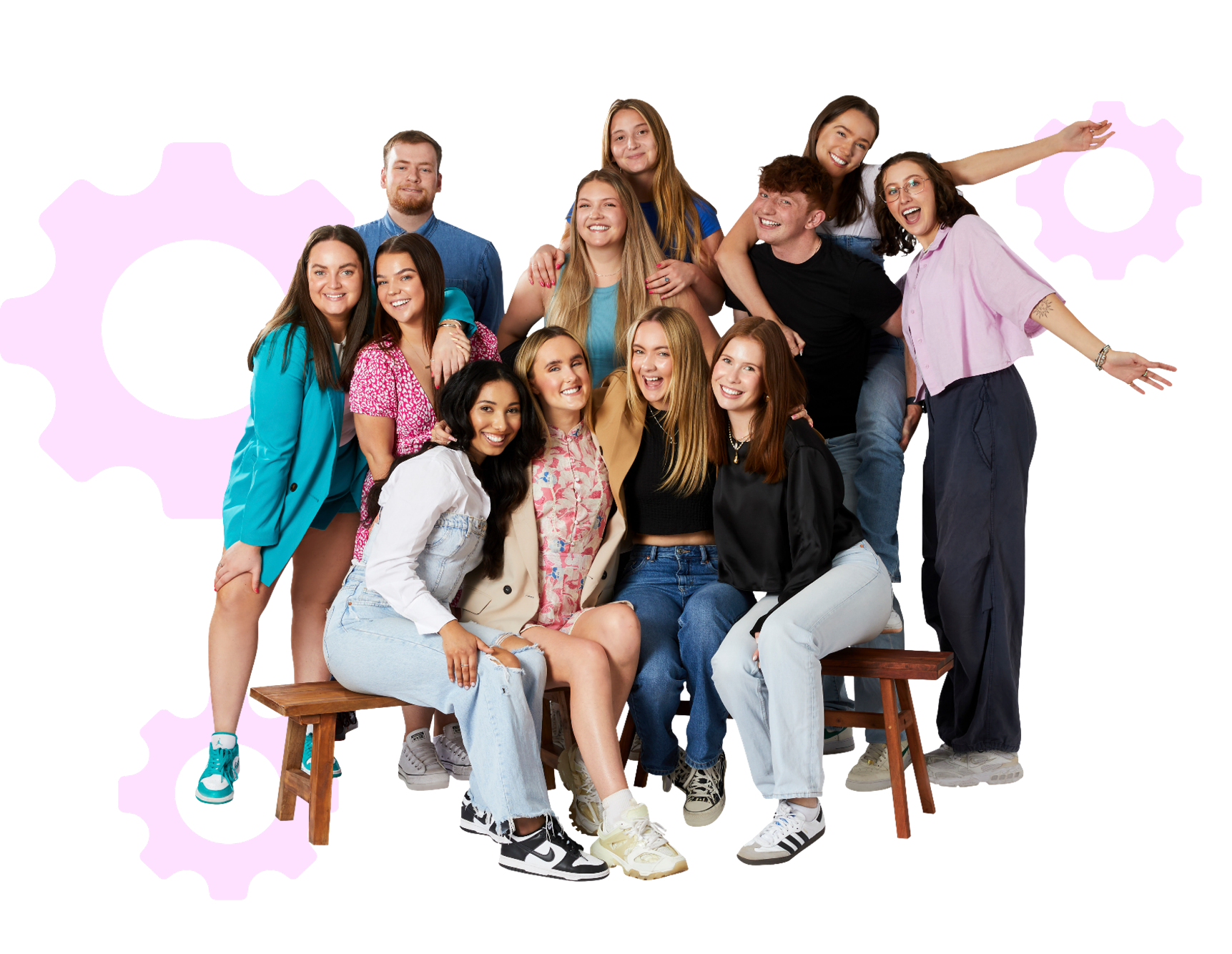 A happy group of teenagers standing together and smiling for a group picture.