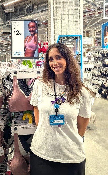 Colleague smiling at camera in store