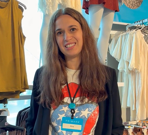 Colleague smiling at camera in store