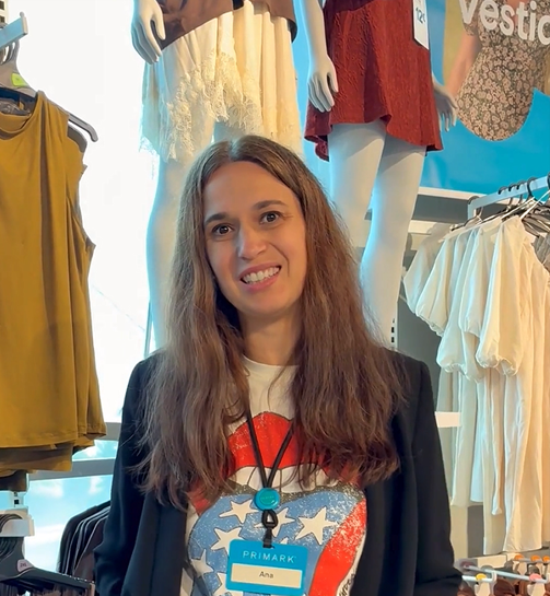 Colleague smiling at camera in store