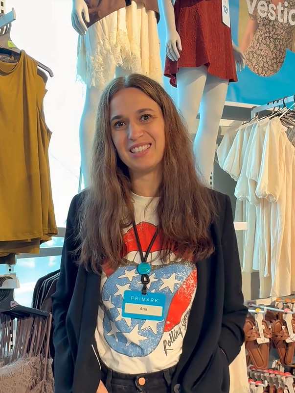 Colleague smiling at camera in store