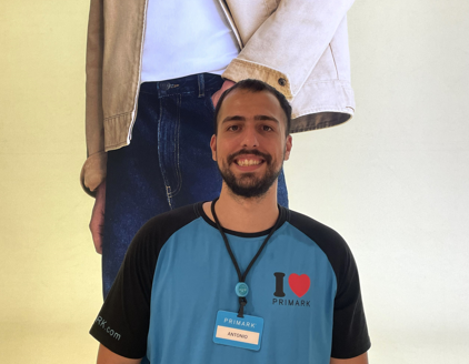 Colleague smiling at camera in store