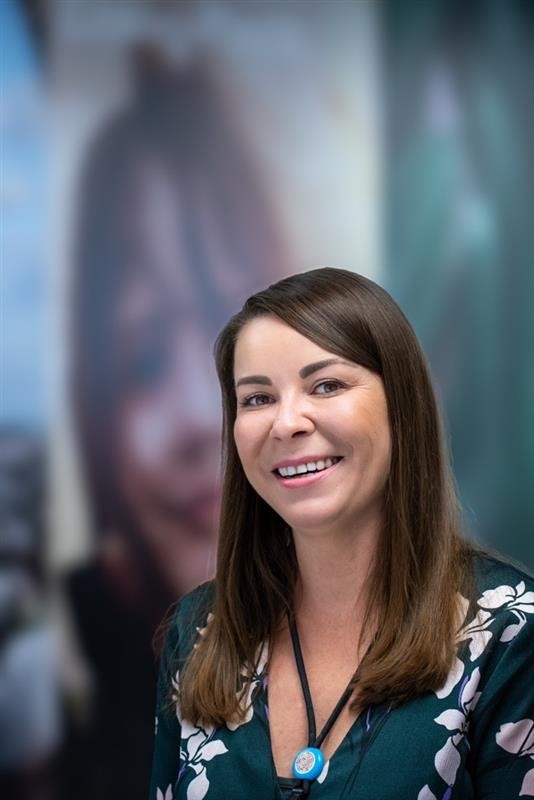 Colleague smiling in store