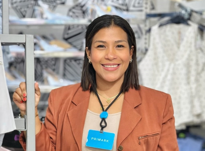 Colleague smiling at camera in store