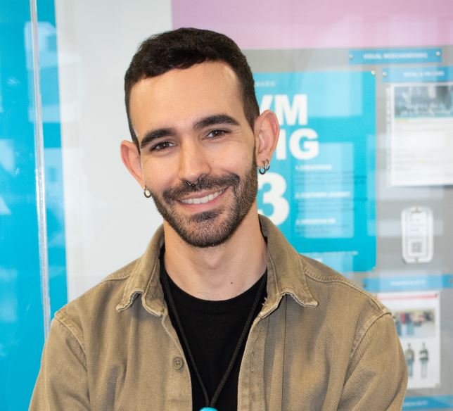 Male colleague smiling in office in Primark store