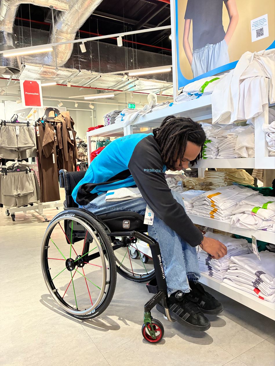 Male colleague in wheelchair working in a Primark store